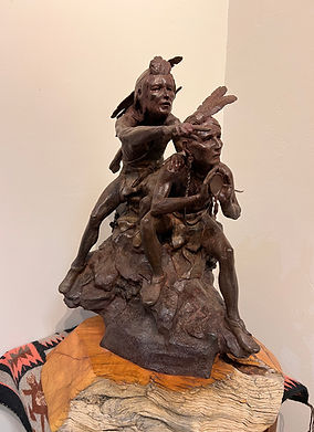 bronze sculpture by Jeff Wolf of two Indians pointing at gold river gallery