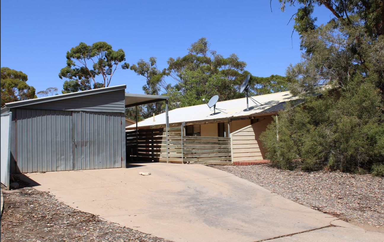 Driveway and exterior view of country-style residential property