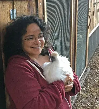 Gabriela Lena Frank holding a chicken