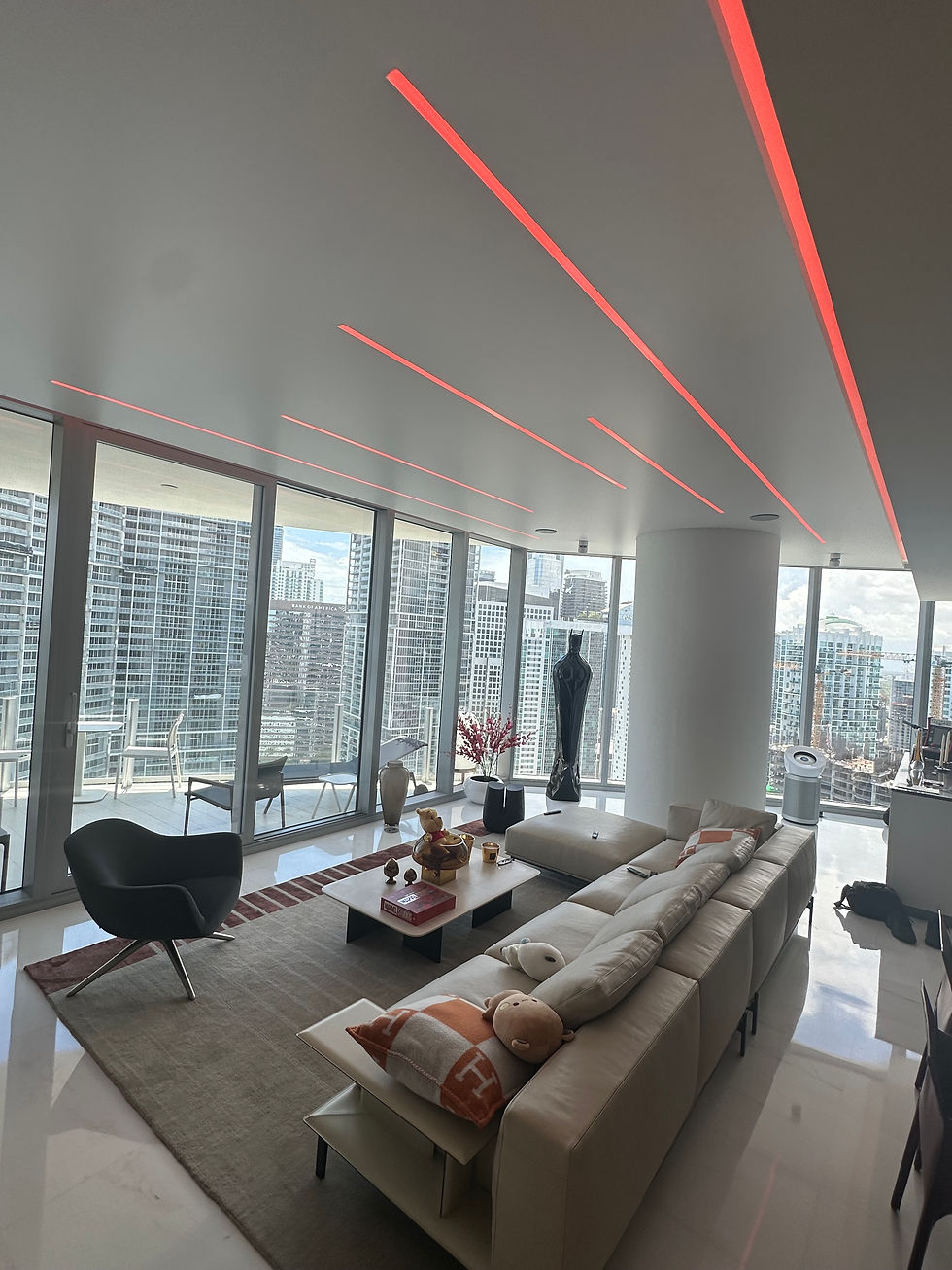 Eye-level view of colorful umbrella ceiling installation with warm fairy lights