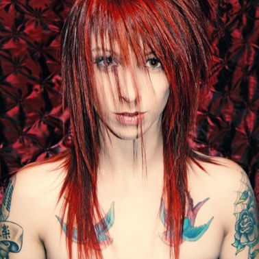 Woman with Red and black colored hair and bangs by Lisa Gregory, founder of Fabrik Salon in Downtown, Missoula