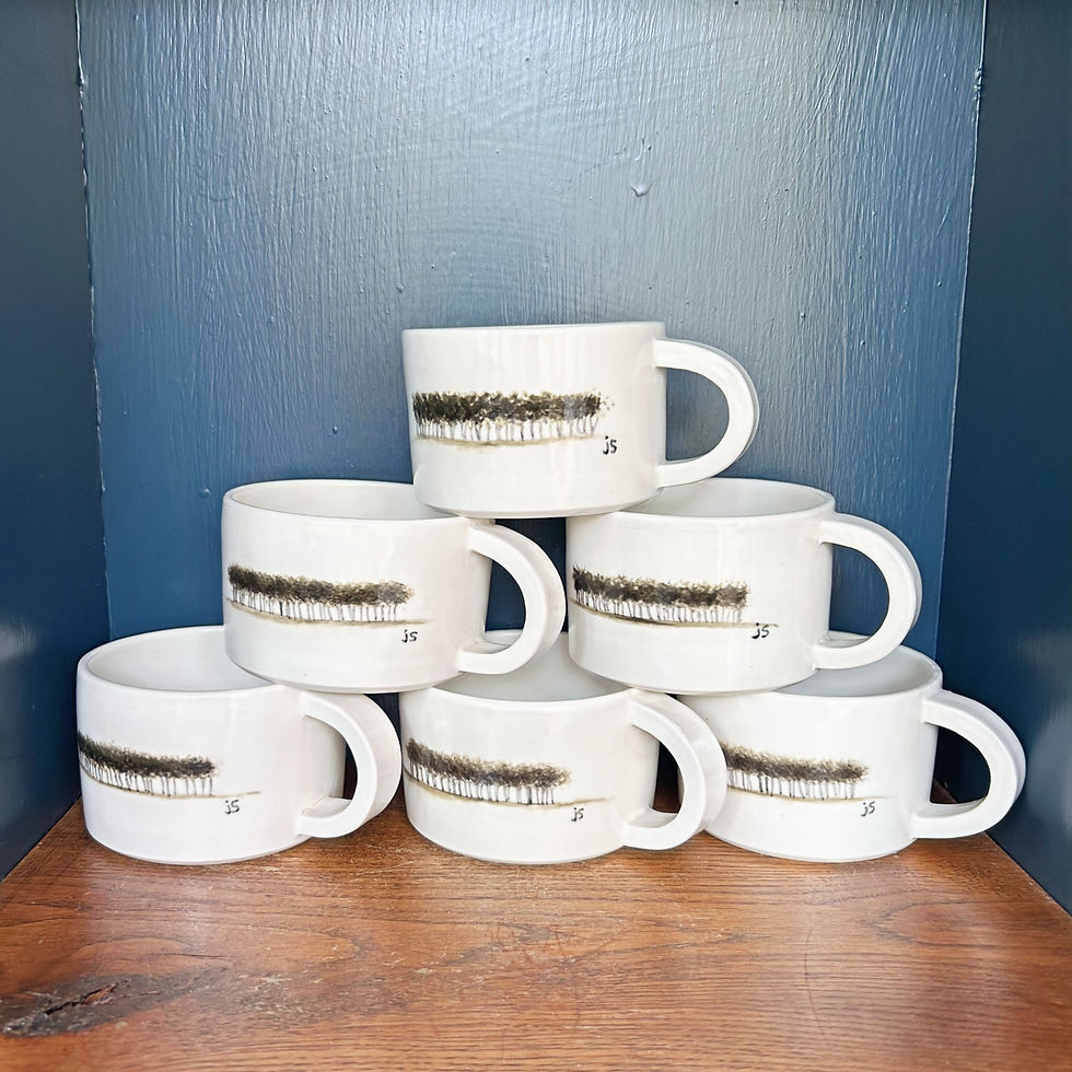 stack of cream porcelain coffee mugs caterpillar tree hand painted