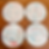view of four coasters showing random splatter glaze decoration