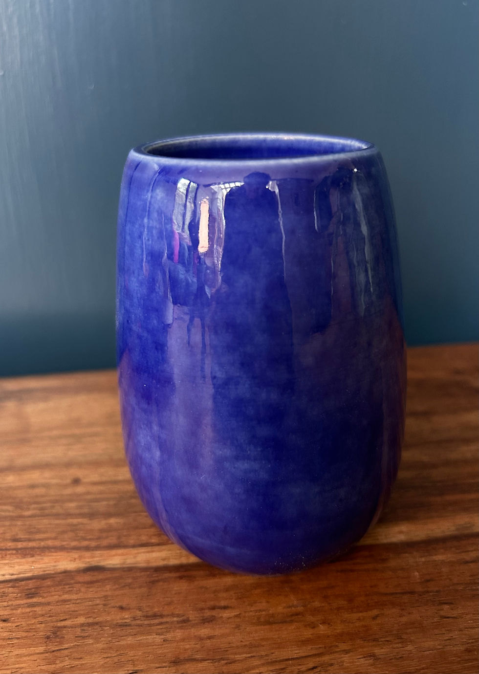 close up of shiny blue glaze on vase