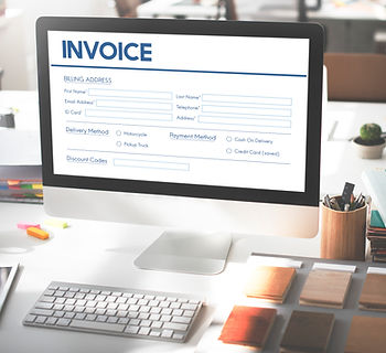 Computer with a invoice on the screen.