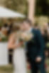 A bride and groom kiss down the aisle after their wedding ceremony in Bend, Oregon.
