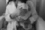 This is a close up black and white image of a postpartum mom holding her newborn baby during a newborn photo shoot in Bend, Oregon.