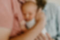 A newborn baby snuggles on his father's chest during a newborn photography session in Bend, Oregon.
