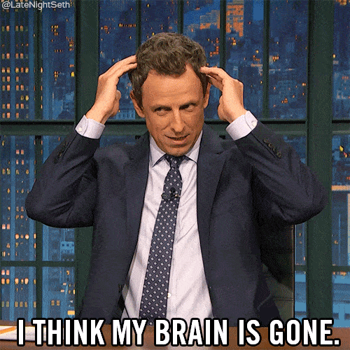 a man wear full set up suit, and touching his head and say "i think my brain is gone"