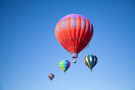 4 hot air balloons at festival