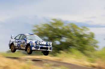 Rally car jump panning shot