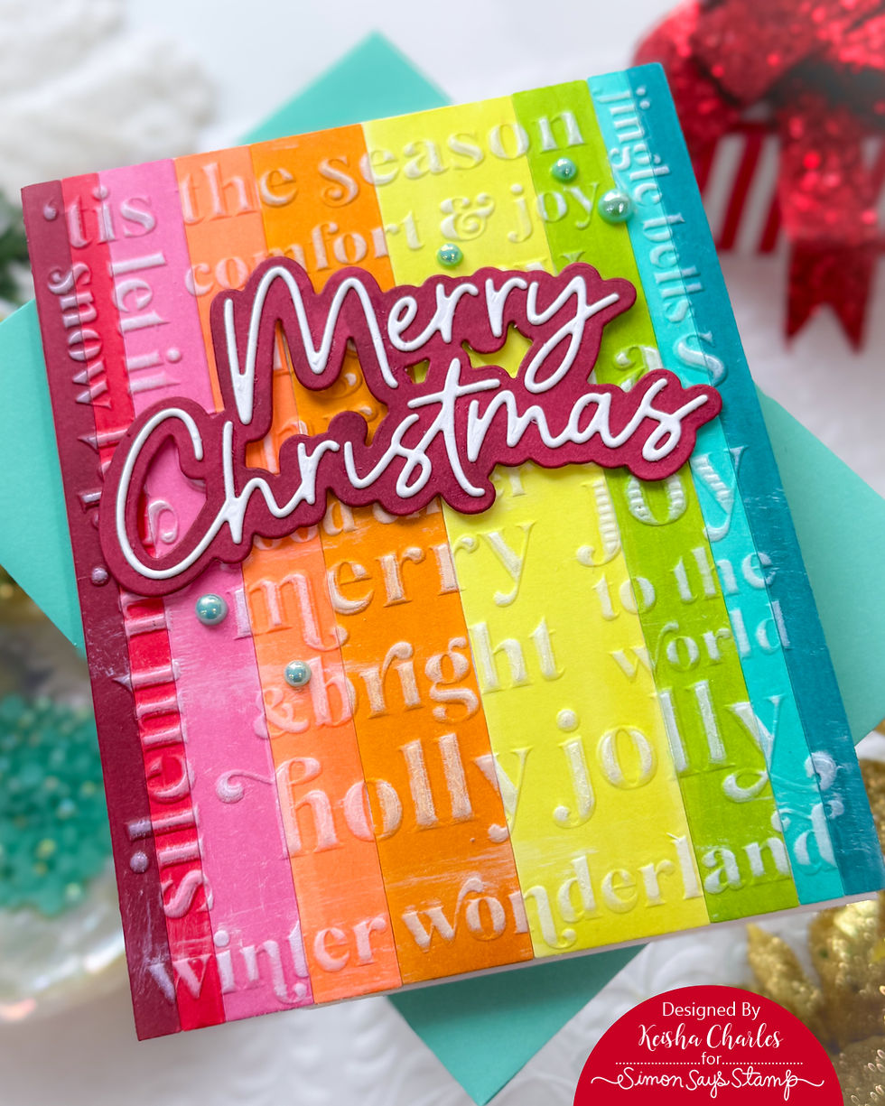 Colorful Christmas card with "Merry Christmas" text. Vertical rainbow stripes with embossed festive words. Green background, pearls, joyful mood.