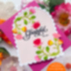 Floral card with vibrant pink, yellow, and orange flowers. Text reads "Grateful for you." Pink background, scalloped edge, cheerful mood.