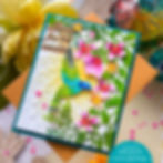Colorful handmade card with hummingbird, pink flowers, and the text Always find the sunshine on a teal and tan background.