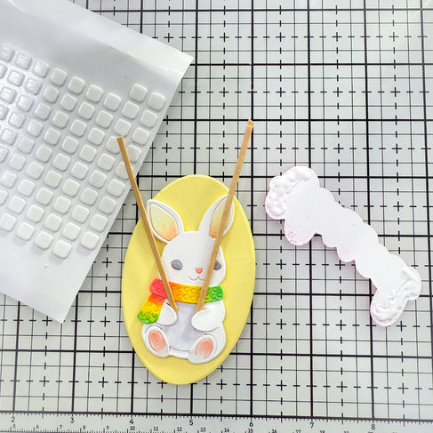bundled bunny with yellow oval background