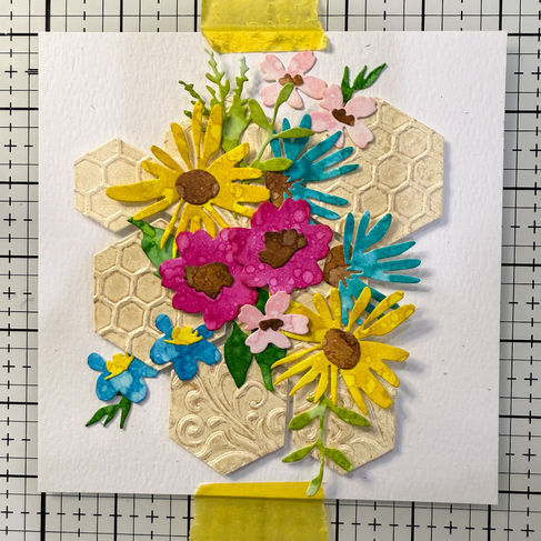 Flower die-cuts arranged on hexagons