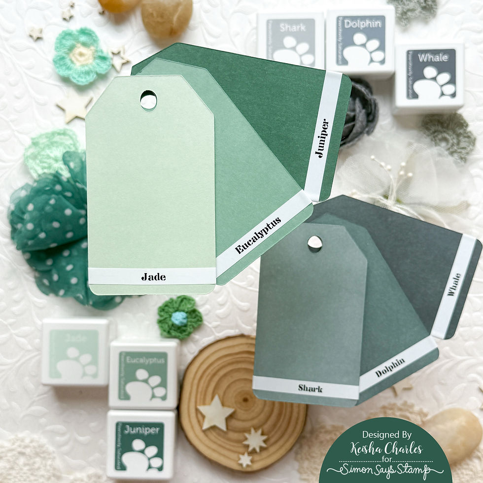 Layered green paper tags labeled Jade, Eucalyptus, Juniper, Shark, Dolphin and Whale on a textured craft background