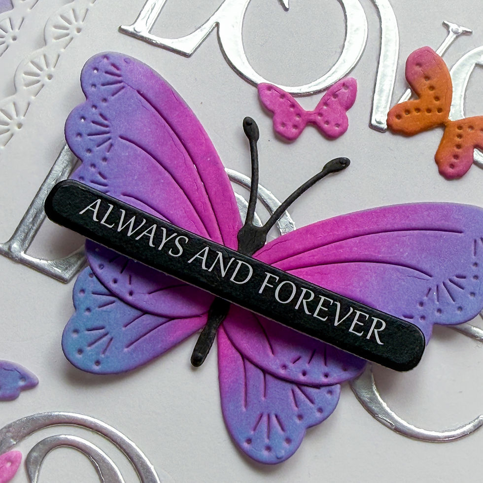 Purple and pink butterfly ornament on silver background with smaller butterflies and the words ALWAYS AND FOREVER across it.
