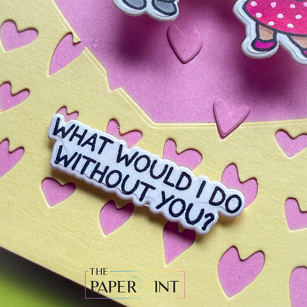 Pink and yellow heart-patterned card with sticker text What would I do without you? and The Paper Mint logo on bottom.
