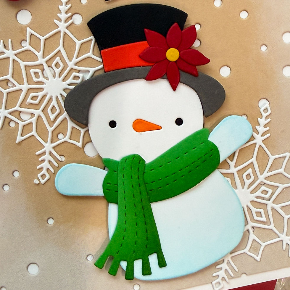 Detail of an ink-blended die-cut snowman beside falling-snow texture and a background edge softened with white pigment ink.