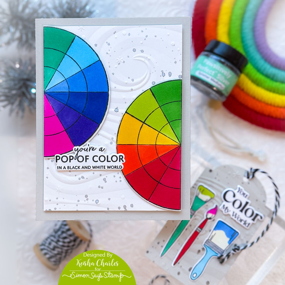 Colorful card with two vibrant color wheels on a textured background. Text reads "you're a POP OF COLOR in a BLACK AND WHITE WORLD."