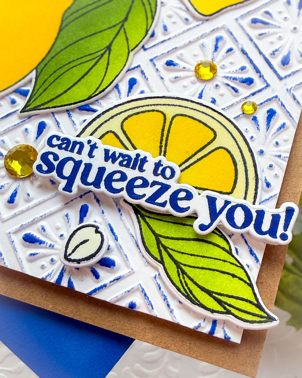 Handmade greeting card with paper lemons, green leaves, blue pattern, yellow gems, and text Can’t wait to squeeze you!