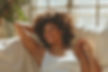 smiling-girl-enjoying-her-day-off-while-lying-sofa.jpg