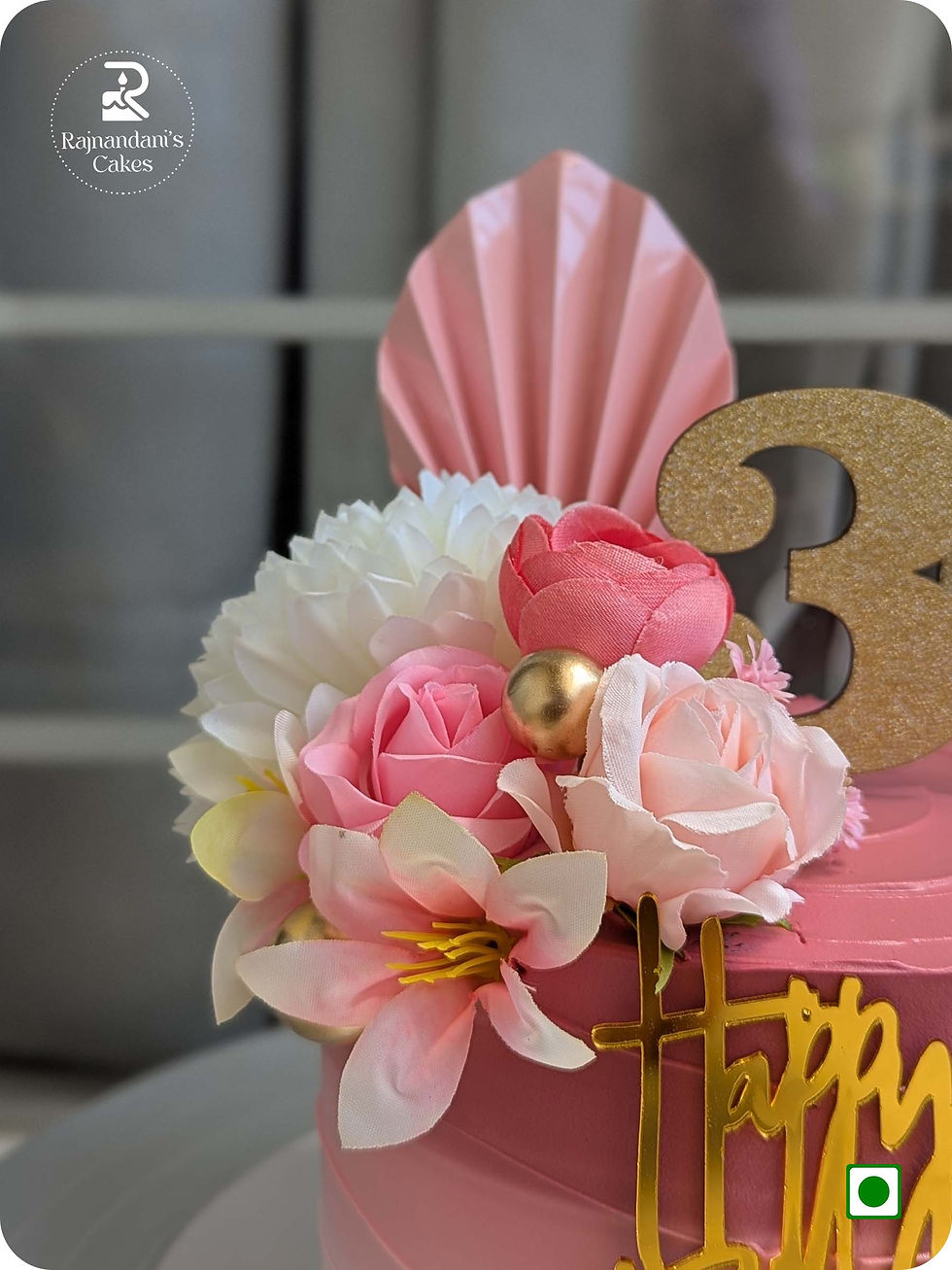 Pink ombre gradient 30th birthday cake decorated with artificial flowers, golden palm spear, and topper by Rajnandani's Cakes