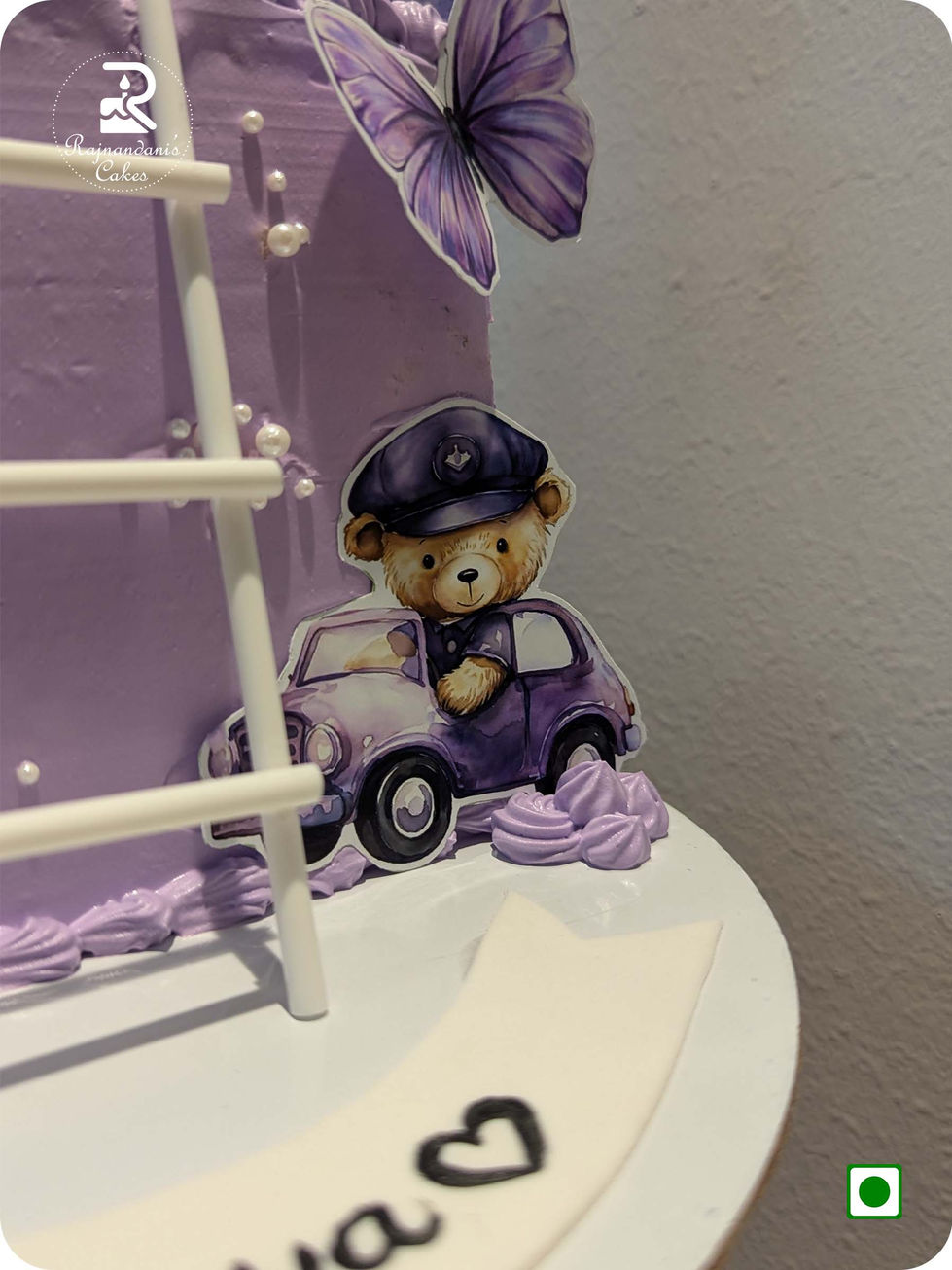 Lavender 1/2 way to one half birthday cake with cute teddy bears, ladder, and butterflies by Rajnandani Cakes in Pune.
