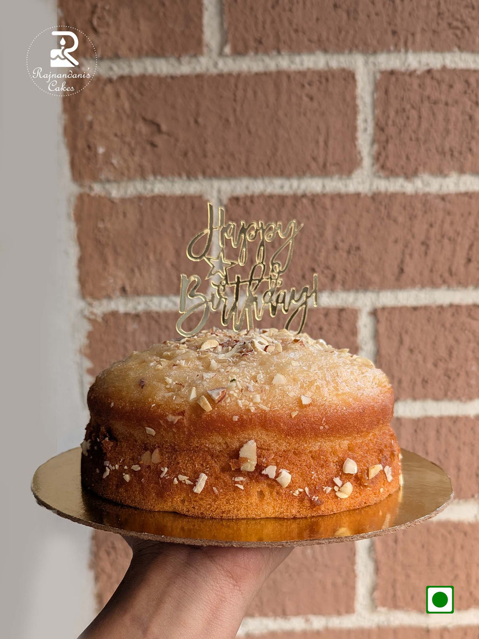 Traditional golden mawa cake topped with crushed almonds, Cashew, Pista