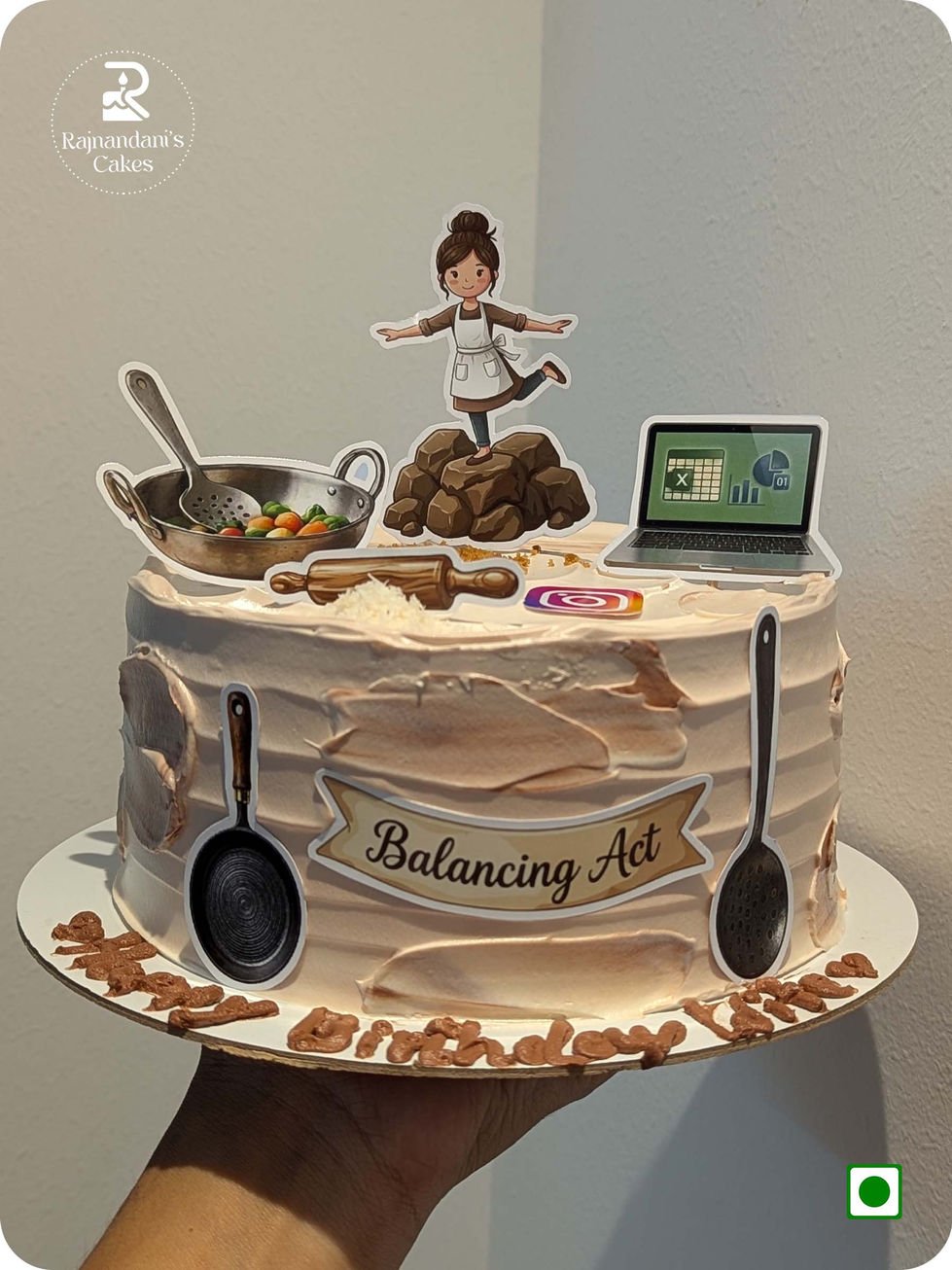 Custom balancing act theme birthday cake representing woman with kitchen tools and laptop cutouts by Rajnandani's Cakes.