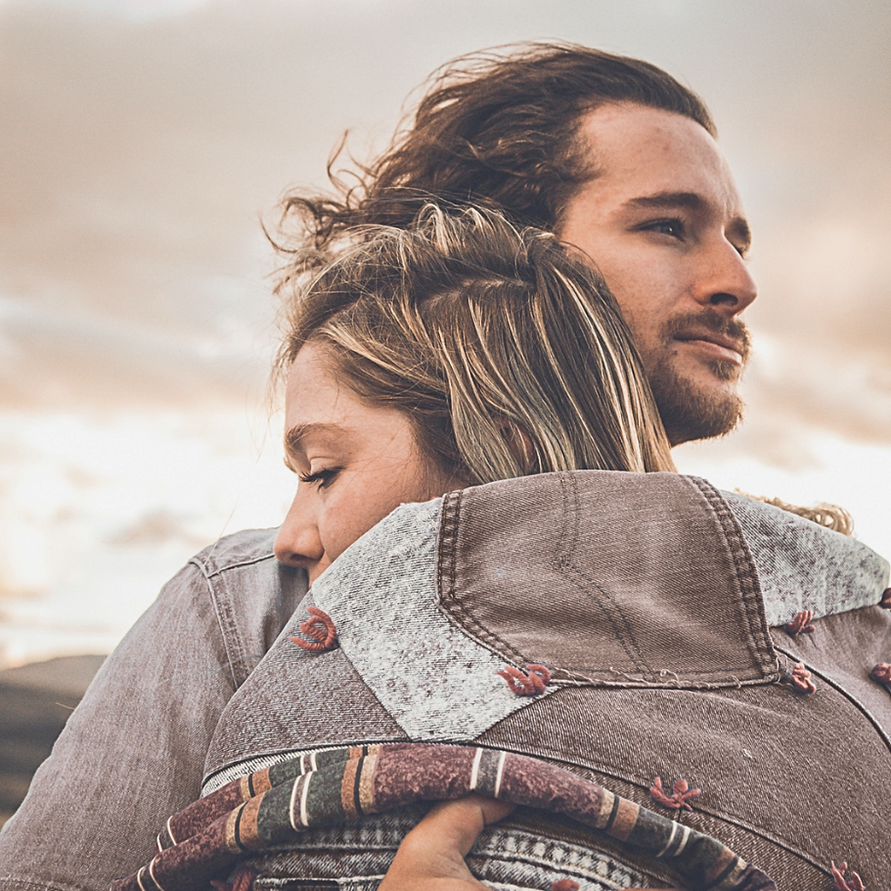 Couple embracing outdoors, peaceful moment