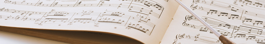 Conductor's baton on sheet music