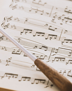 Conductor's baton on sheet music