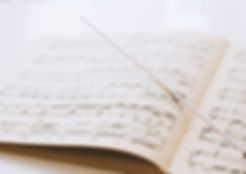 Conductor's baton on sheet music