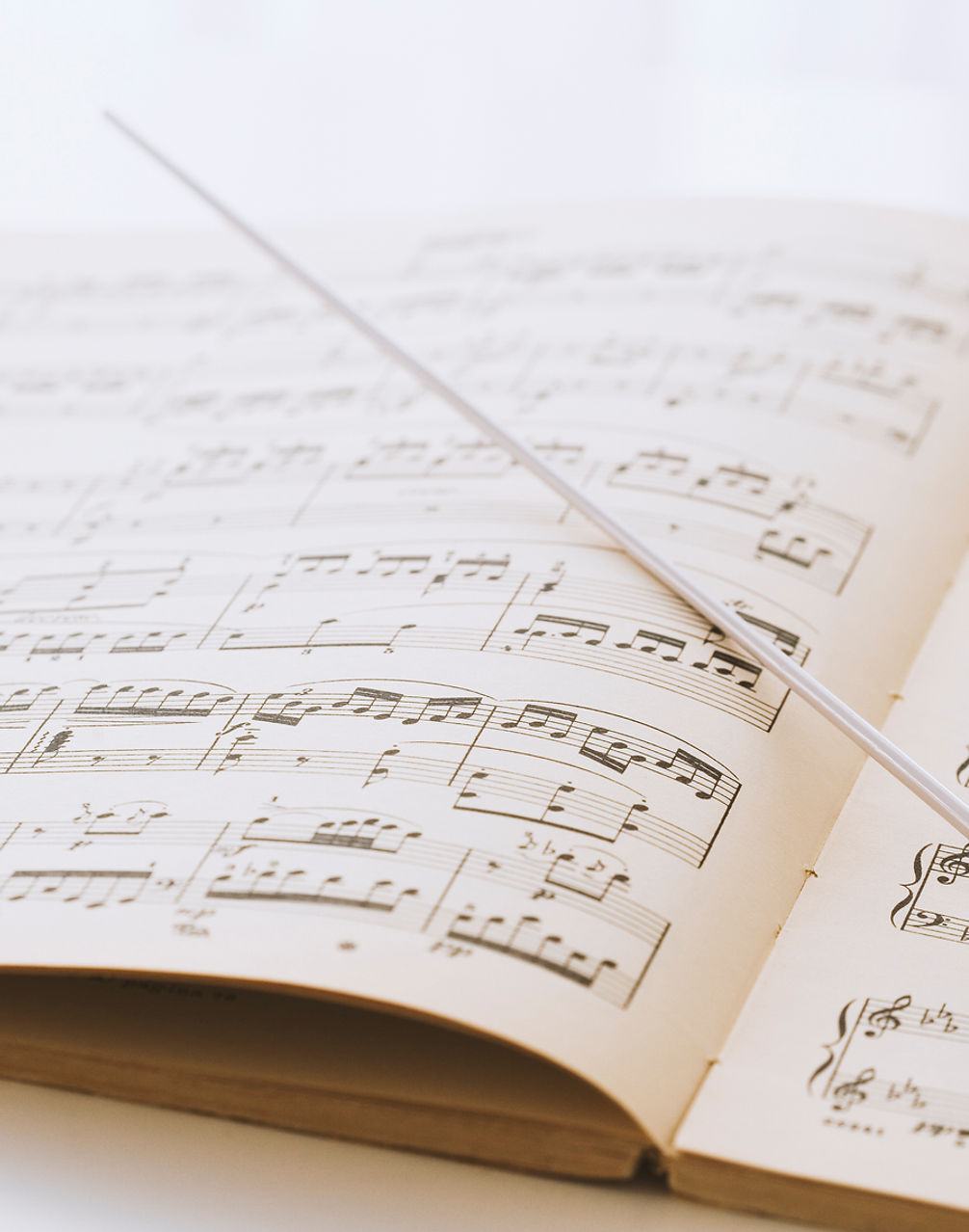 Conductor's baton on sheet music