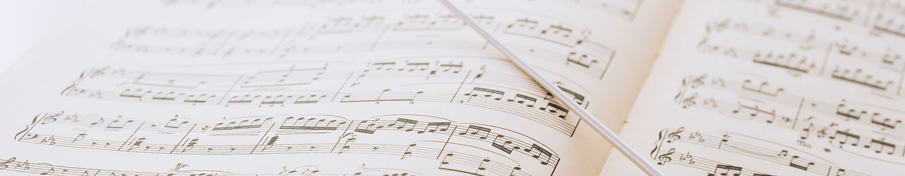 Conductor's baton on sheet music