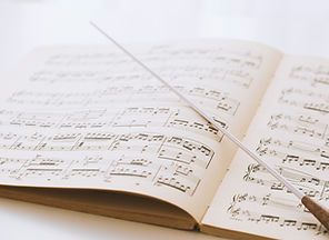 Conductor's baton on sheet music