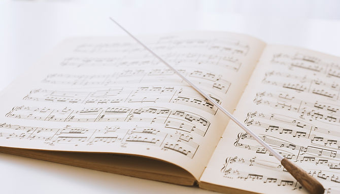 Conductor's baton on sheet music