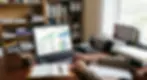 Business owner reviewing financial reports and cash flow dashboard.