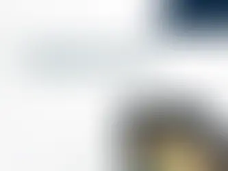 Small business owner reviewing bookkeeping records and financial documents