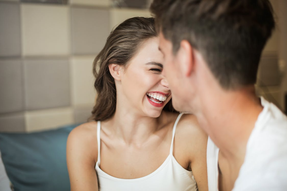 Woman laughing with a friend after a casual encounter, illustrating attachment and intimacy topics with a Therapist specializing in Relationship Therapy and Couples Therapy in Orange County.
