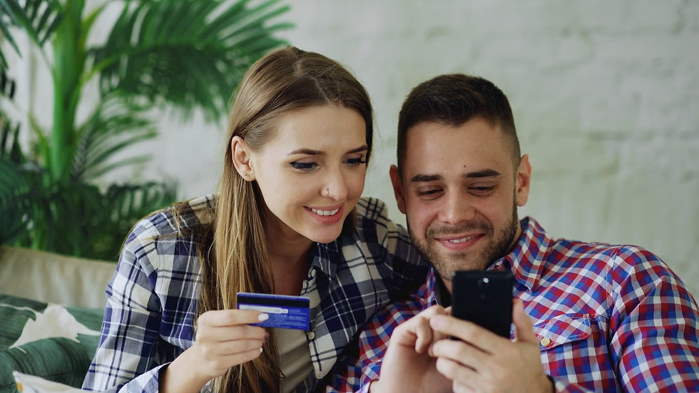 Couple excitedly looking at their phone while exploring a prescription libido treatment together, highlighting conversations about sexual desire and evidence-based care often discussed in sex therapy and relationship counseling in Orange County.