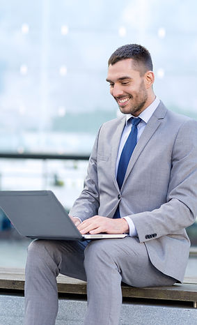 Man on laptop looking for company formation service for new independent business