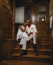 Engagement photo of couple sitting on steps