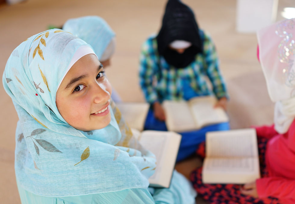 smiling-girl-with-headscarf-studying-with-friends-2026-04-13-23-40-28-utc.jpg