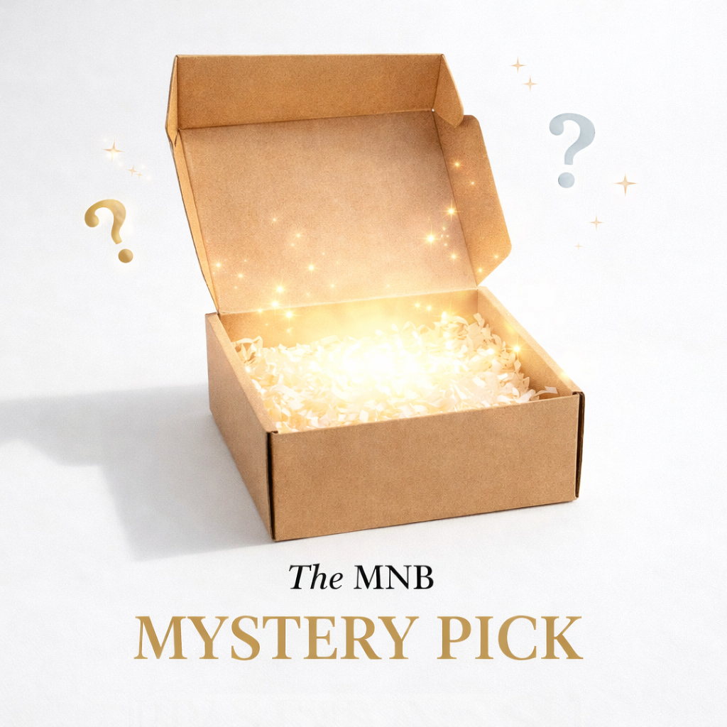 Open kraft box with soft golden glow inside, representing The MNB Mystery Pick curated surprise box
