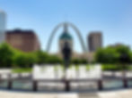 View of the Gateway arch National Park with the runner statue and fountain