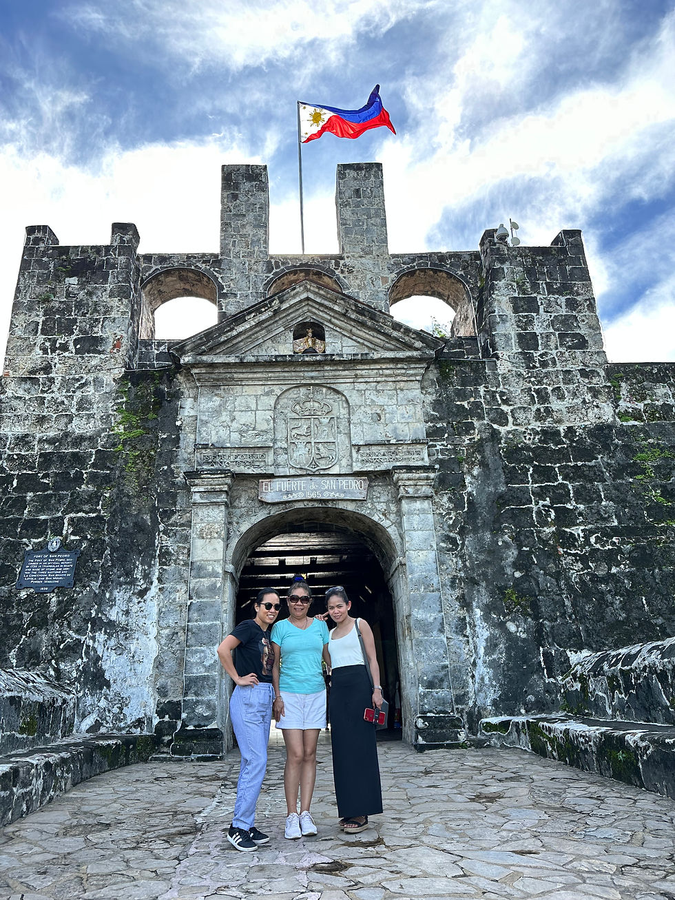 My mom, sister and myself posing infront of the Fort San Pedro entrance
