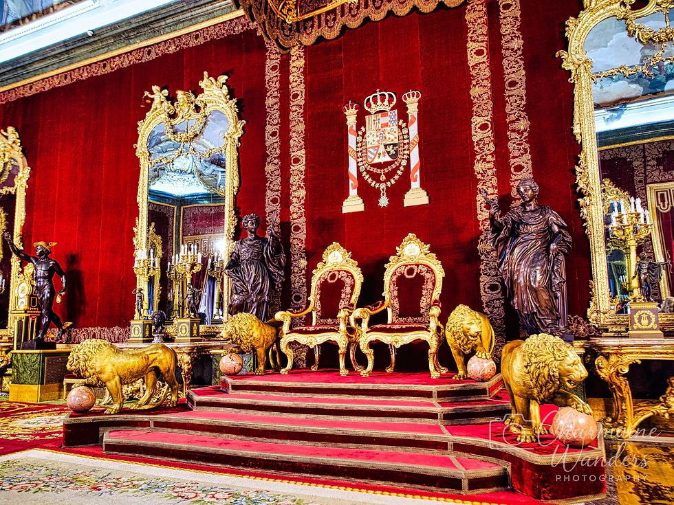 Opulent red and gold throne room with ornate chairs, lion statues, large mirrors, and intricate tapestry, exuding grandeur and luxury.